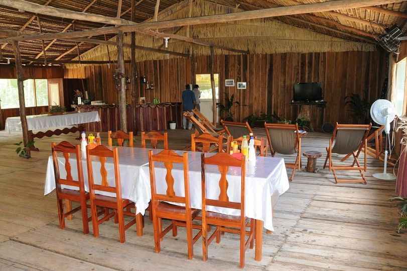 The dining room, one long table set for the evening